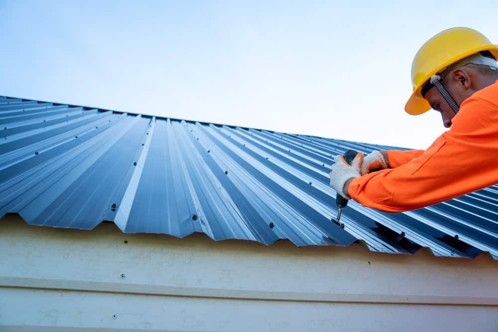 man working on roof repairs