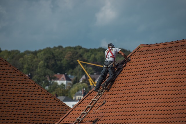 man working at the roof